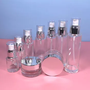 20g 50g skaidraus stiklo odos priežiūros indelis su sidabriniu dangteliu, 20 ~ 100ml stikliniai buteliukai su losjonu ir purškimo pompa