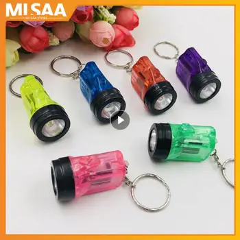 Mini LED žibintuvėlio žibintuvėlio lemputė Kelių spalvų baterija maitinamas kišeninis raktų pakabukas Lauko avarinių raktų pakabukas Lempos kūrybiškumas